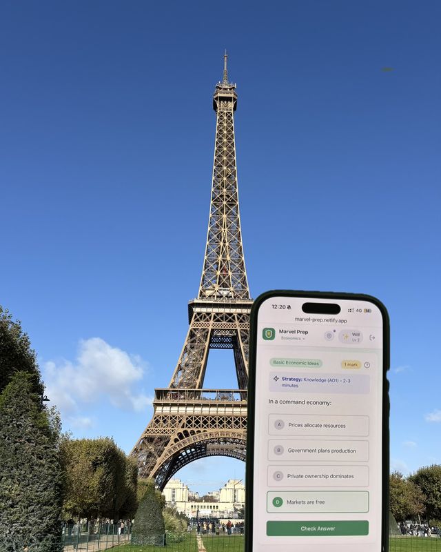 The MarvelPrep app open on a phone in front of the Eiffel Tower
